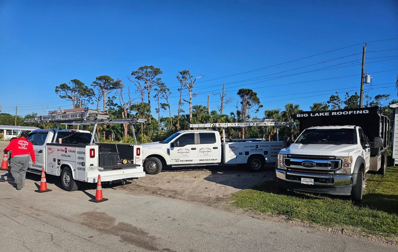 Big Lake Roofing trucks and crew